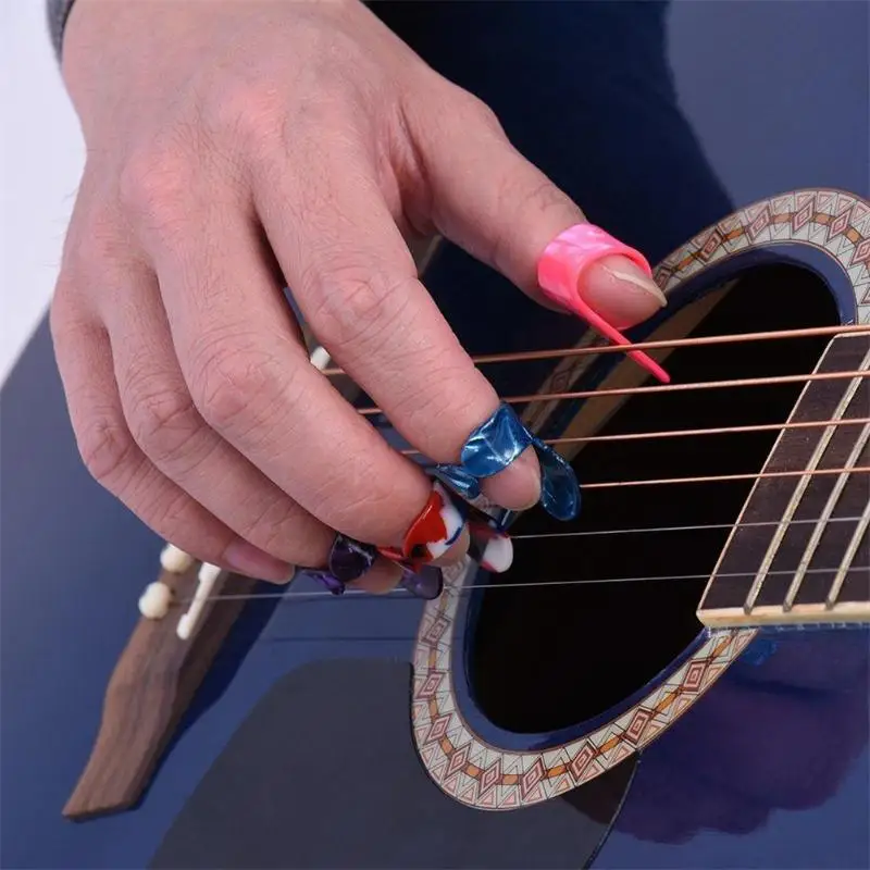 4pcs Guitar Thumb Finger Picks Paddles Nail Plectrums Guitar Picks