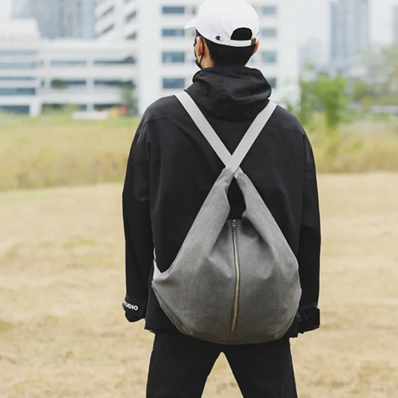 

Korean version of the female bag multi-function youth backpack shoulder slung men's solid color backpack casual shopping travel