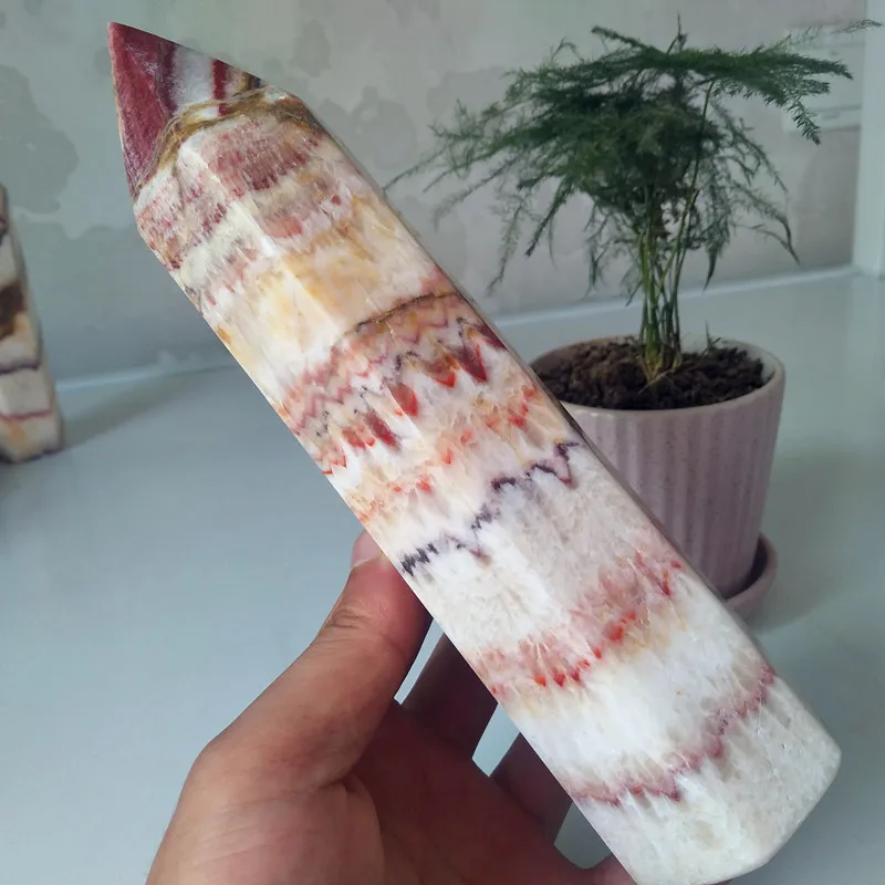 A Oversized stone wand point natural rhododendron crystal decorated obelisk and hexagonal crystal point healing crystals