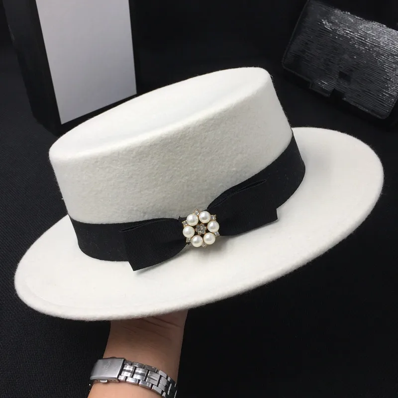 Зимняя женская шапка шерстяная белая новая Кепка на плоской подошве с бантом perlite шляпа фетровая шляпа