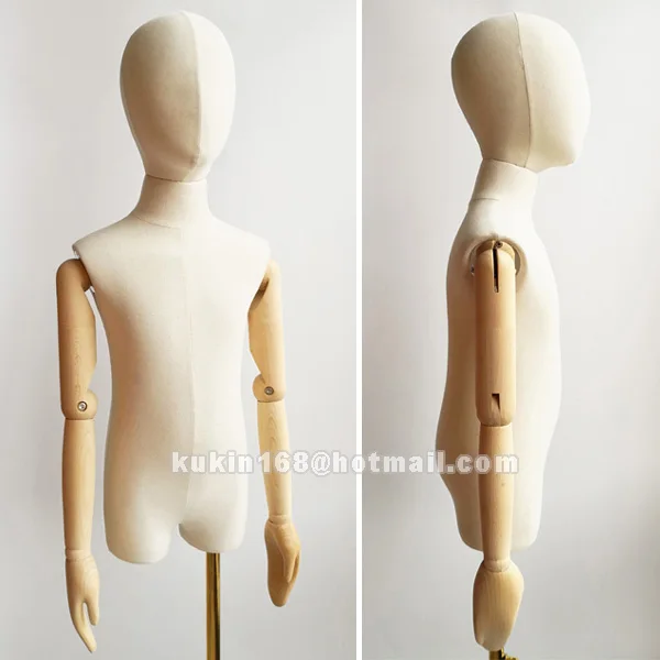 

Fabric covered children mannequin with wood sculpture hands