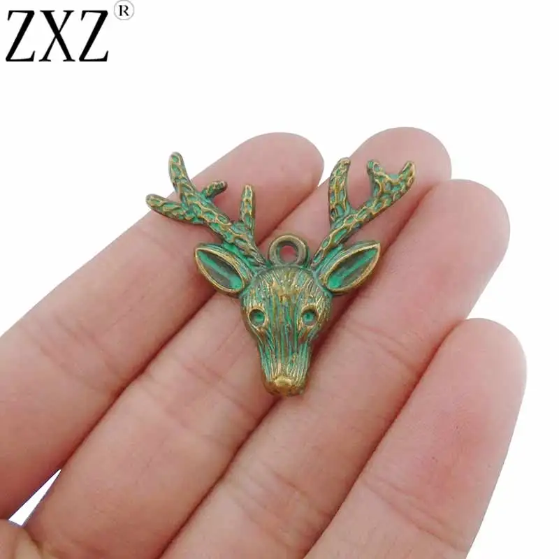 

ZXZ 10pcs Green Verdigris Patina Reindeer Deer Animal Charms Pendants for Jewelry Making Findings 36x32mm