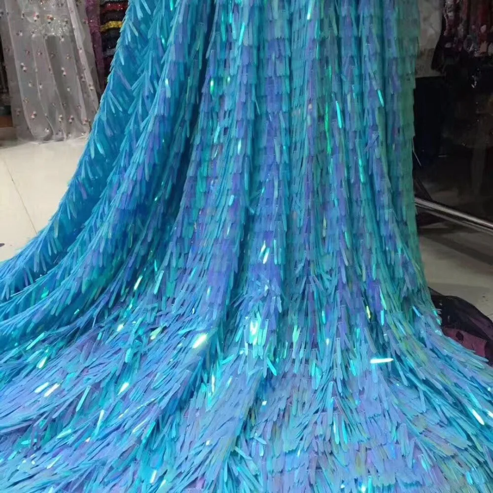 

latest version of a large sequined lace fabric holographic image, with colorful Latin clothing fabrics and a major holiday party