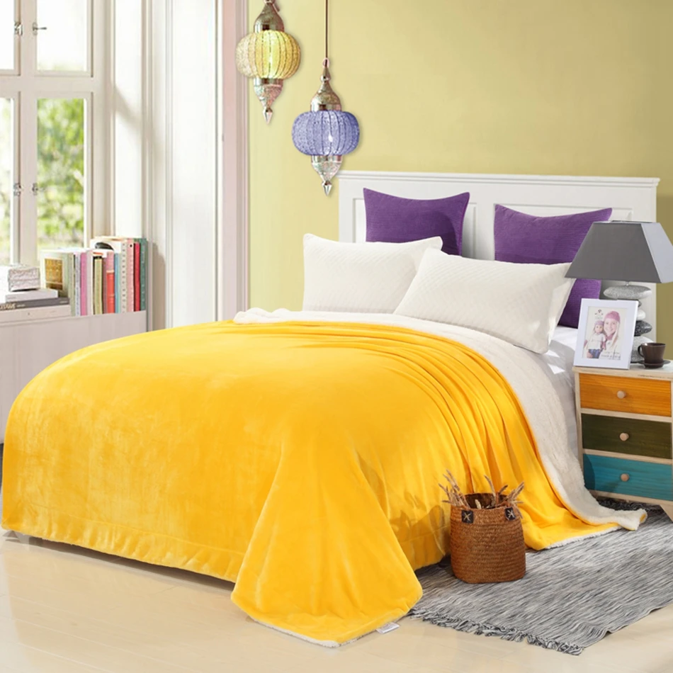 yellow solid color throw blanket on the bed soft flannel fleece