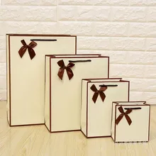 Free Design 100PCS/LOT Cream-coloured Paper Gift Bag Packing Bag Print LOGO Free Shipping Free Design 100PCS/LOT Cream-coloured Paper Gift Bag Packing Bag Print LOGO Free Shipping