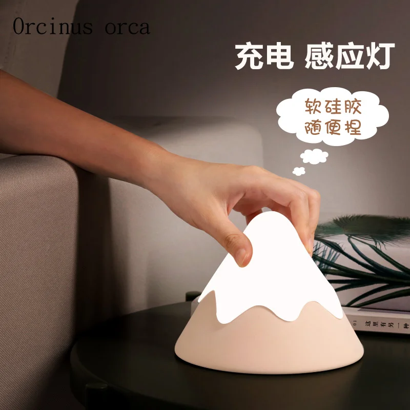 

Human body induction bedside night light infant feeding silicone sleeping lamp rechargeable creative cartoon small volcano lamp