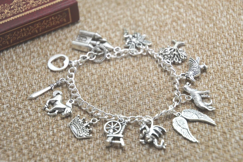 

12pcs Maleficent inspired bracelet Castle Fairy Tree Crow Wolf Wings Dragon Horse True Love charm bracelet