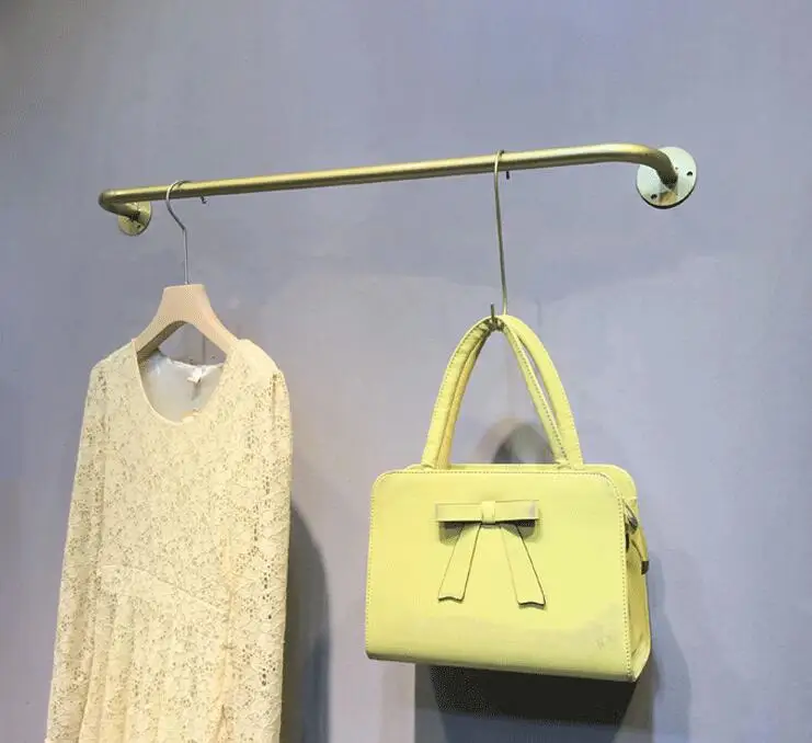 Clothes shop display rack wall hook is hanging gold iron hanging clothes rack shop.