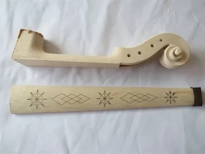 

Violin making material, violin head and carved Maple finger board are beautifully crafted