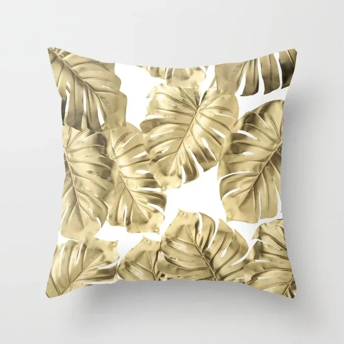 gold-monstera-leaves-on-white-