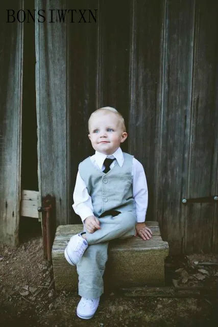 Outfit-with-gray-pants-and-vest-white-shirt-and-black-tie