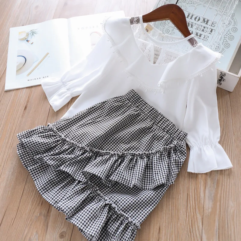 

Roimyal Wholesale 2019 summer/Spring new girls lotus leaf collar white long-sleeved shirt + black plaid skirt children's suit