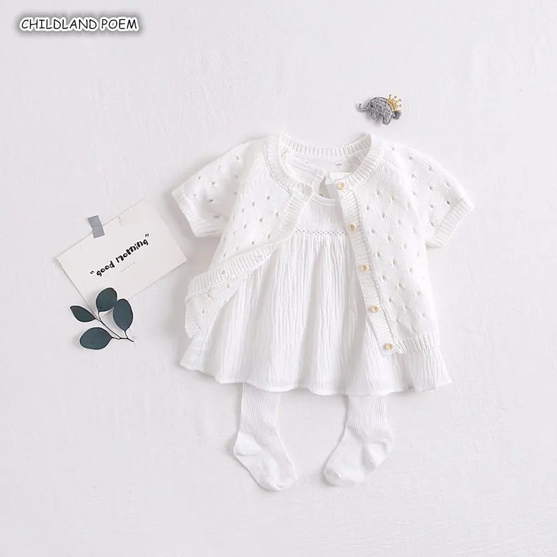 white knitted baby clothes
