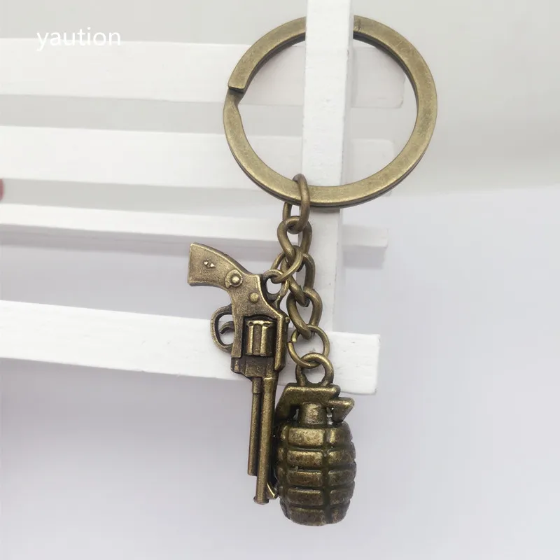 

1pcs New Antique Bronze Plated 3D Military Grenade + Gothic metal gun Pendant Keychain