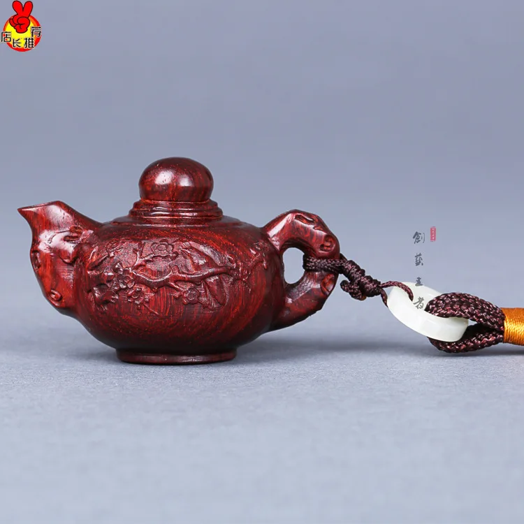 

The teapot handle India rosewood lobular Rosewood teapot with carved wooden ornaments car pendants for crafts Xian