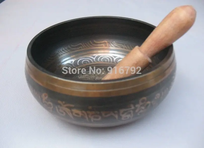 

Asian Buddhist mantra traditional Tibetan singing bowls bronze Buddha
