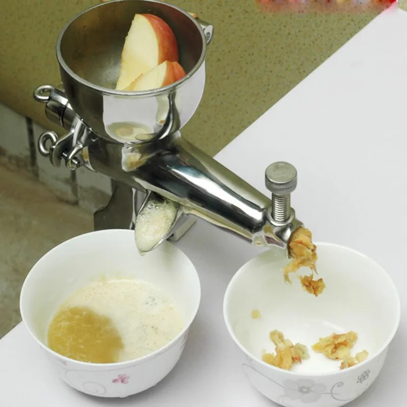 

Masticating juicer with hand operated wheat grass juicing machine