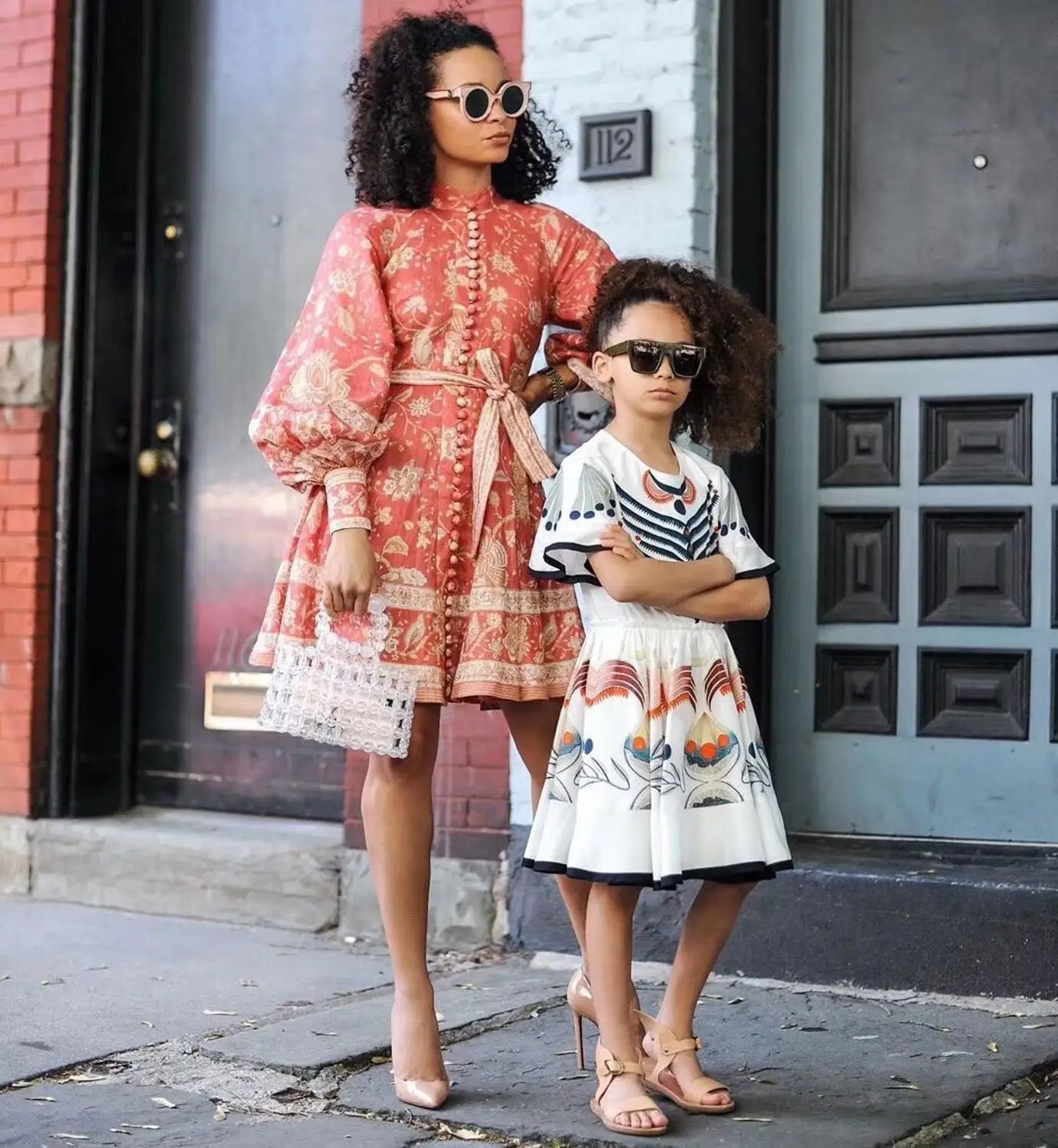 

Red linen paisley print structured dress buttoned mandarin collar wide three quarter length sleeves front button waist belt