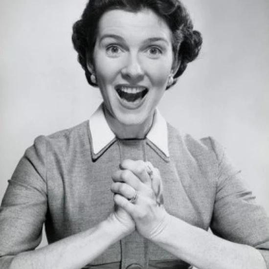 Portrait of a mid adult woman looking surprised with her hands clasped Poster Print (24 x 36)