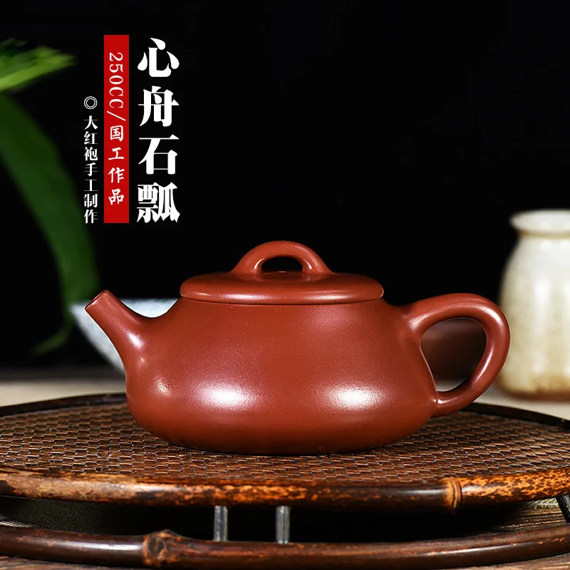 

Ore Teapot Famous Full Manual Teapot Wholesale Generation Hair Self-marketing Bright Red Shi Po, A Muddy Heart Boat In A Gown