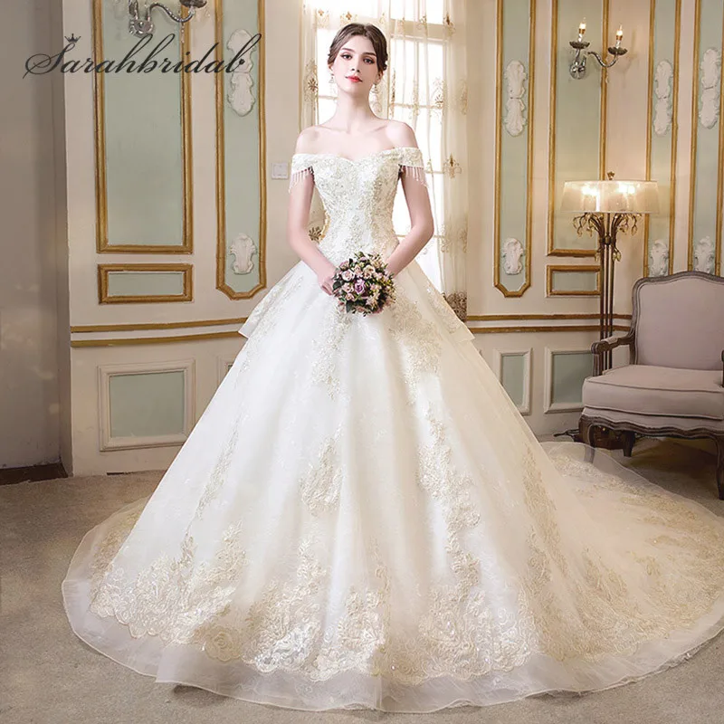 

Glamorous White Ball Gown Wedding Dresses with Bow Luxury Beading Crystal Off the Shoulder Elegant Royal Train Bridal Gown L3953