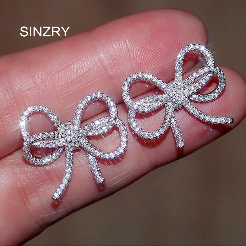 

SINZRY clear white cut cubic zircon micro paved hollow bowknot stud earring for women brilliant jewelry