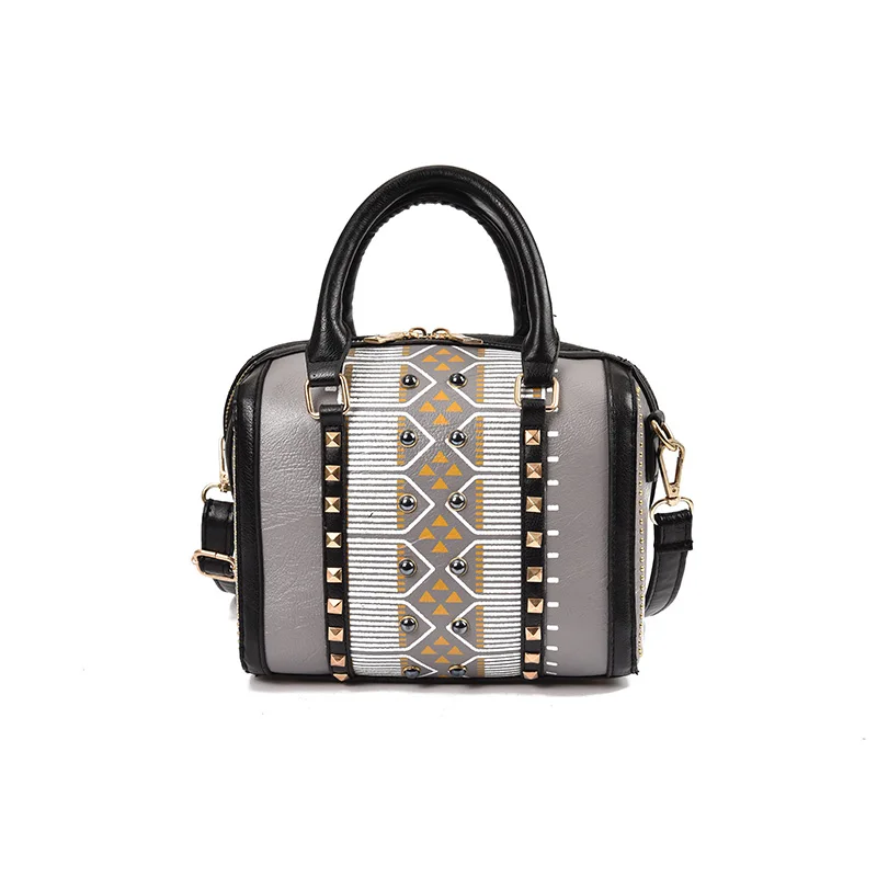 

The new spring/summer 2017 women bag suture Boston bag inclined shoulder bag women rivet leather handbags