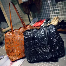 The New High-end Hand-carved Hollow Retro PU Handbags Europe and America Vertical Section Shoulder Bag