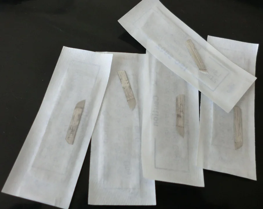 

20Pcs Tattoo Factory 0.6MM Thickness Tattoo Permanent Makeup Blades Common Permanent Makeup 14-Pin Needles Blades