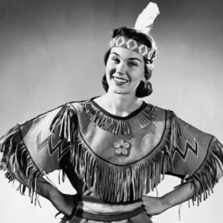Young woman smiling with arms akimbo Poster Print (24 x 36)