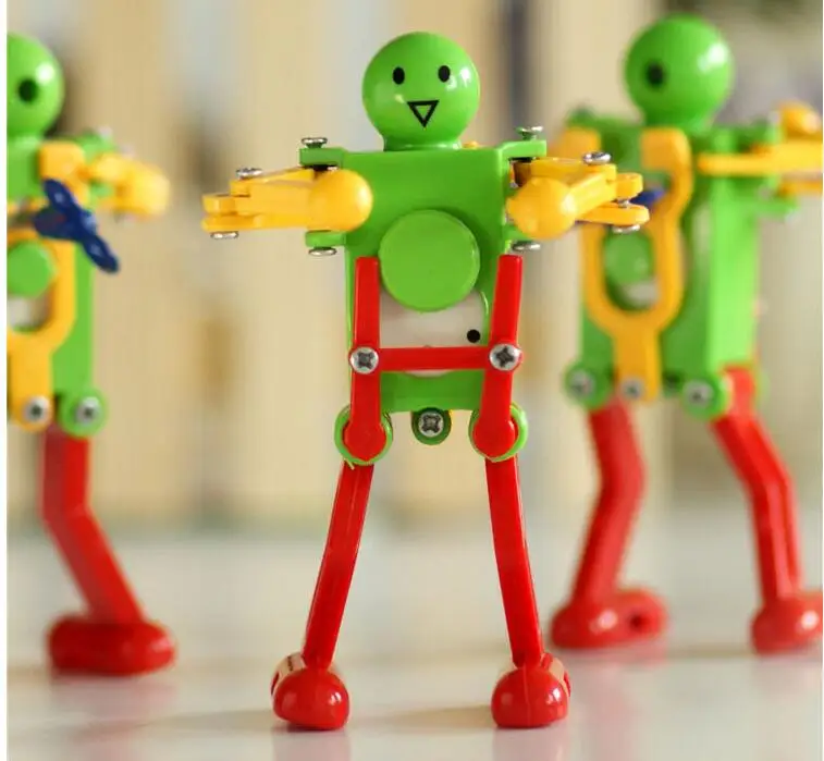 

So Coll !!! 5pcs/set Clockwork Spring Wind Up Dancing Robot Toy Children Kids Gift hot sale