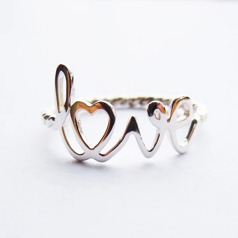 

Wellmade Solid 925Sterling Silver Twist Love Ring