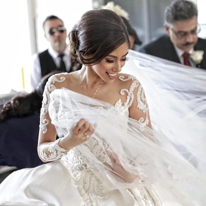 gorgeous-sheer-neck-wedding-dresses-long-sleeve-cathedral-train-lace-applqies-button-back-bridal-gowns-custom-made-lusury-wedding-dress (1)_