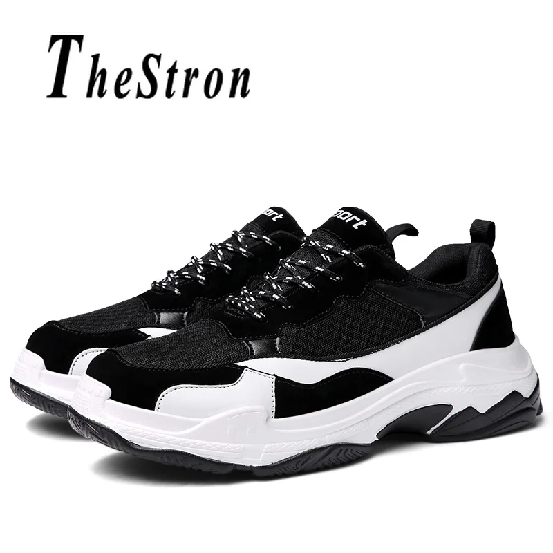 black trainers with white soles