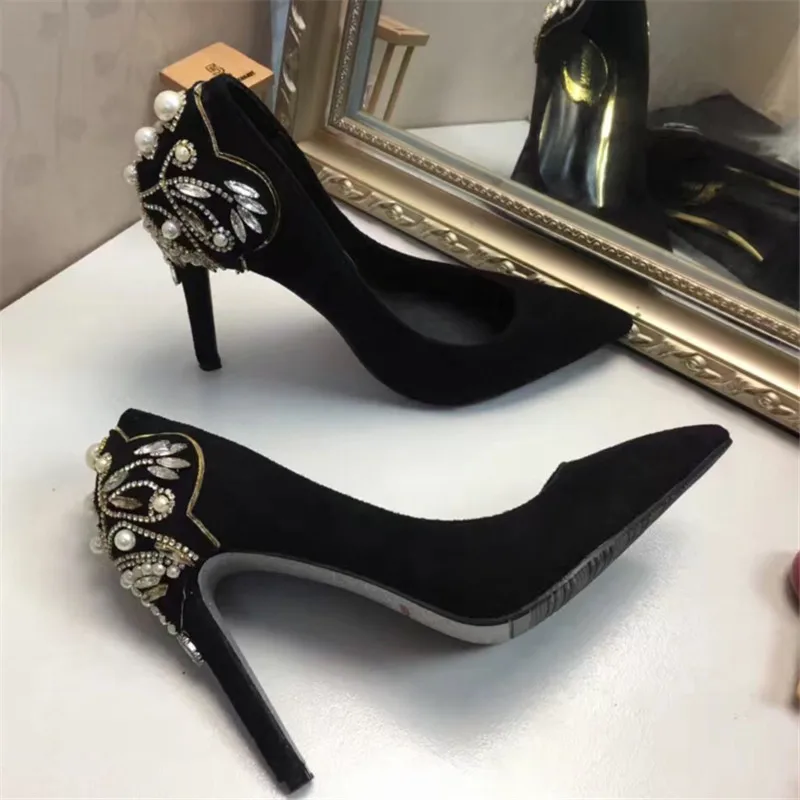 black heels with pearls on them
