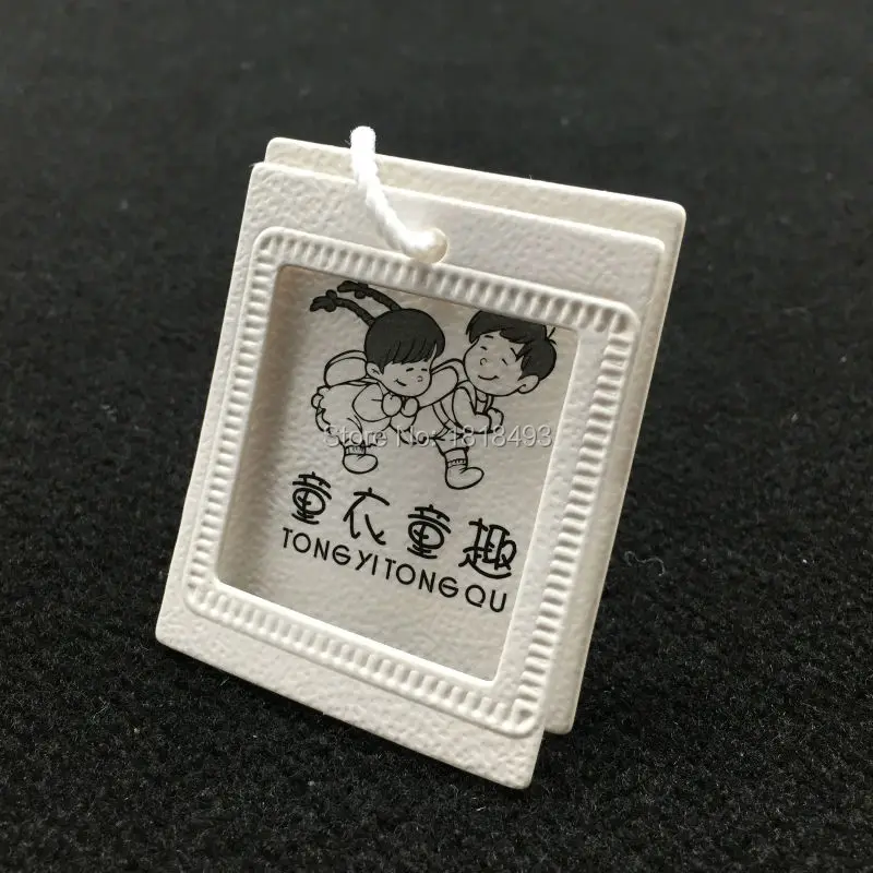 Customized clothing embossed logo tags/garment paper tag printing