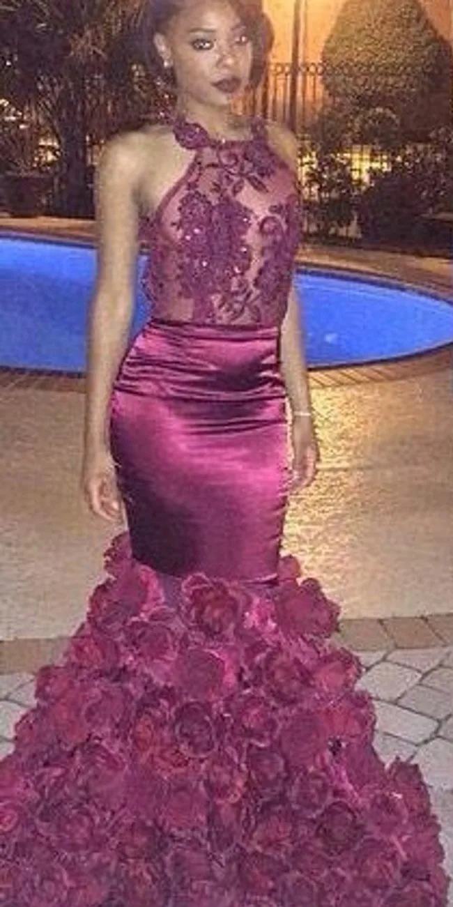 black prom dress with roses at the bottom