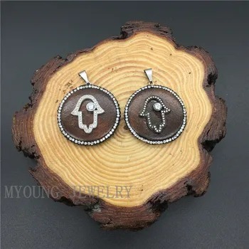 

MY1142 Round Wood Pendant With Rhinestone Paved edges And Micro paved Atima Hamsa Hand at the front