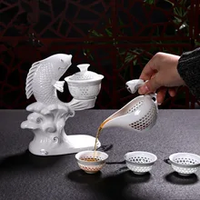 Цзиндэчжэнь рыба фарфор Dehua чайный набор кунг-фу чашки автоматический белый керамический полый прозрачный синий и белый чайный горшочек, чашка