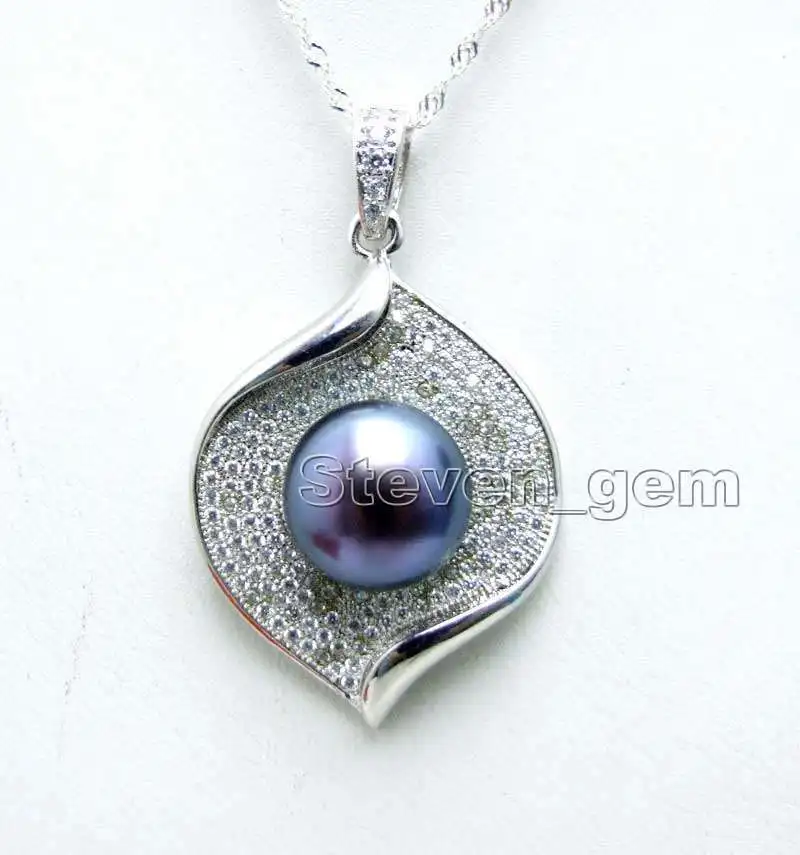 

18"11-12 mm round Tahitian black green pearl necklace