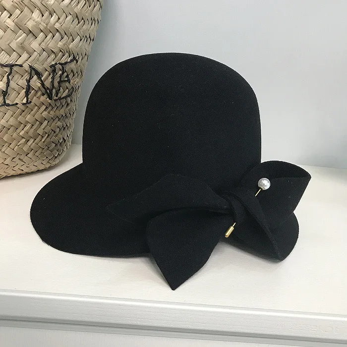 winter bucket hat 2019 Autumn And Winter New Bucket Basin Of Bowknot Pearl Wool Hat Female Warm Fashion Female Warm black fur bucket hat