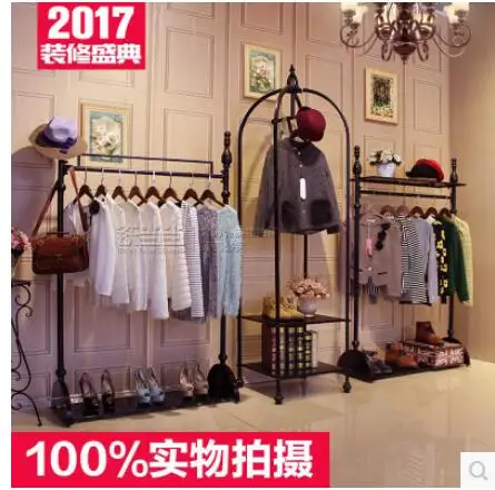 

The clothing rack of an iron art clothing store shows the vintage shelf clothes of the island shelf in a console