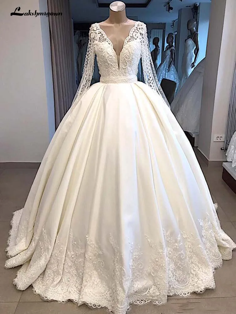 

Modest Long Sleeve Ball Gown Wedding Dresses 2019 Sheer Back With Buttons Covered Plunging V Neck Long Dubai Arabic Bridal Gown