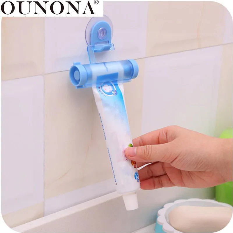 

OUNONA Rolling Toothpaste Squeezer with Suction Hanger for House Home (Random Color)