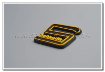 

custom PVC label, red background with white embossed logo, groove line for sew in fabric.