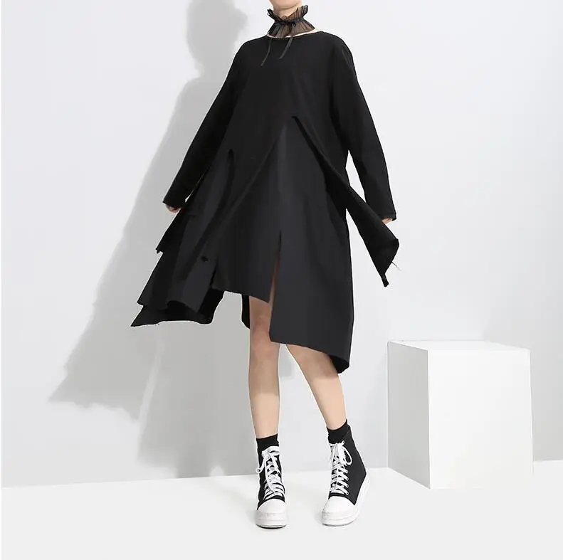 

New spring Round collar Long sleeves solid color white black irregular release dress Women's fashion tide