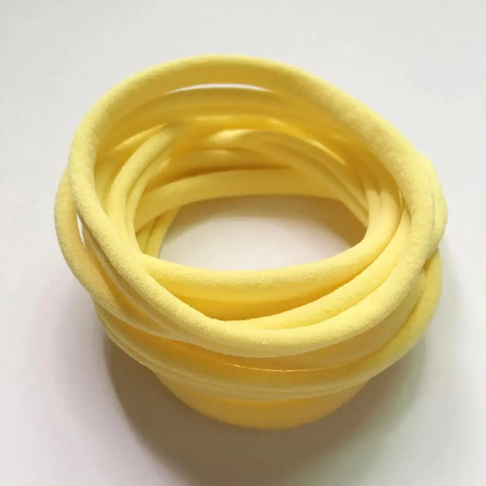 Baby yellow 100 шт./лот, Новые однотонные нейлоновые эластичные повязки на голову, супер мягкие и не маркие, бесследные детские повязки на голову - Цвет: Baby yellow