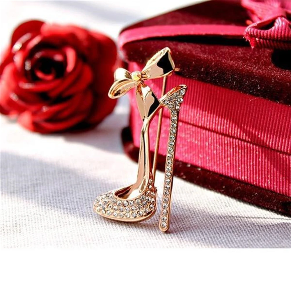 black heels with brooch