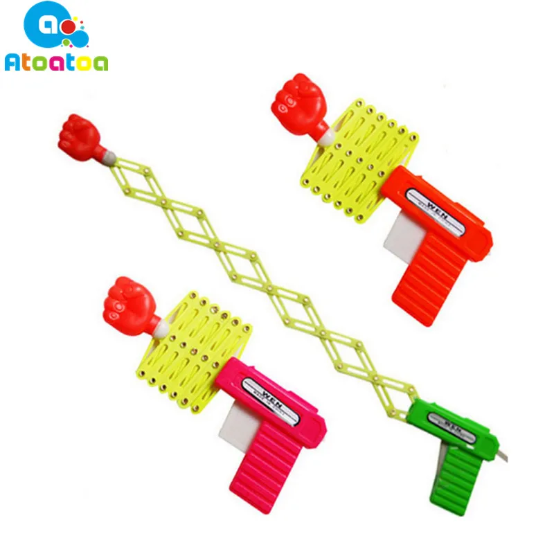 

2Pcs/set Gags Practical Jokes Funny magic elastic telescopic fist gun magic tricks toys for Toys Gifts Color Randomly
