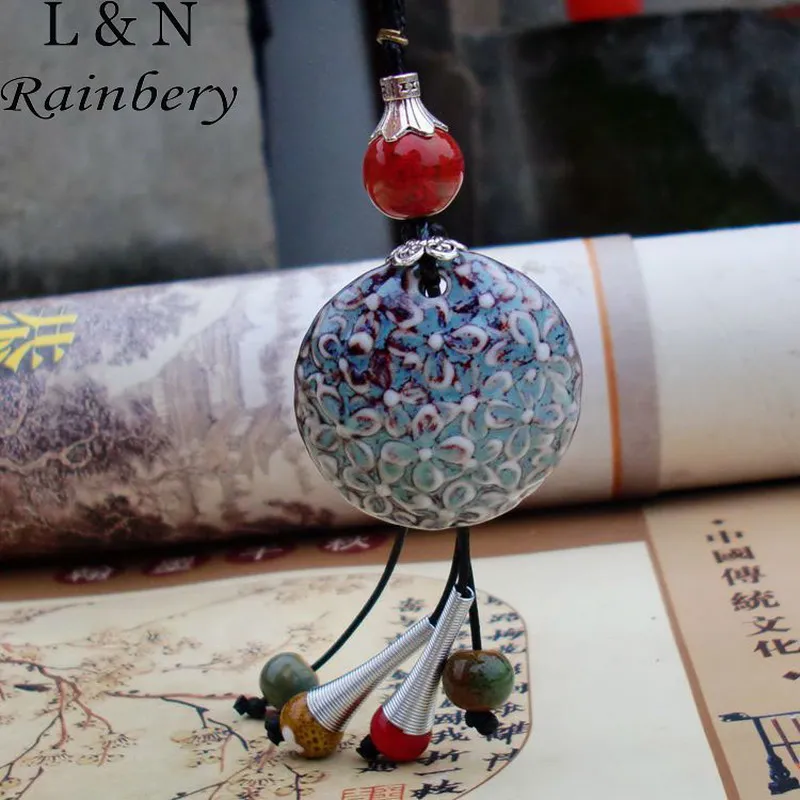 

Rainbery Ethnic Ceramic Pendants Rope Chains Necklaces 2017 Trendy Women Long Manual Weave Sweater Necklace Hollow Leaf Jewelry
